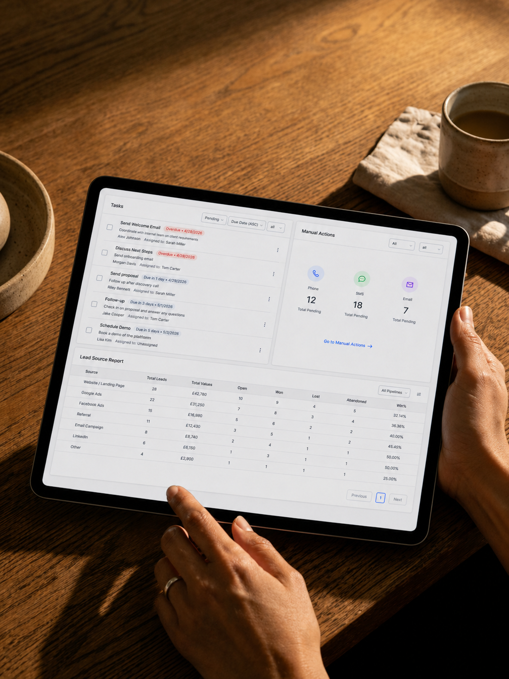 Flowkei Line unified inbox running on a tablet, held over a wooden table